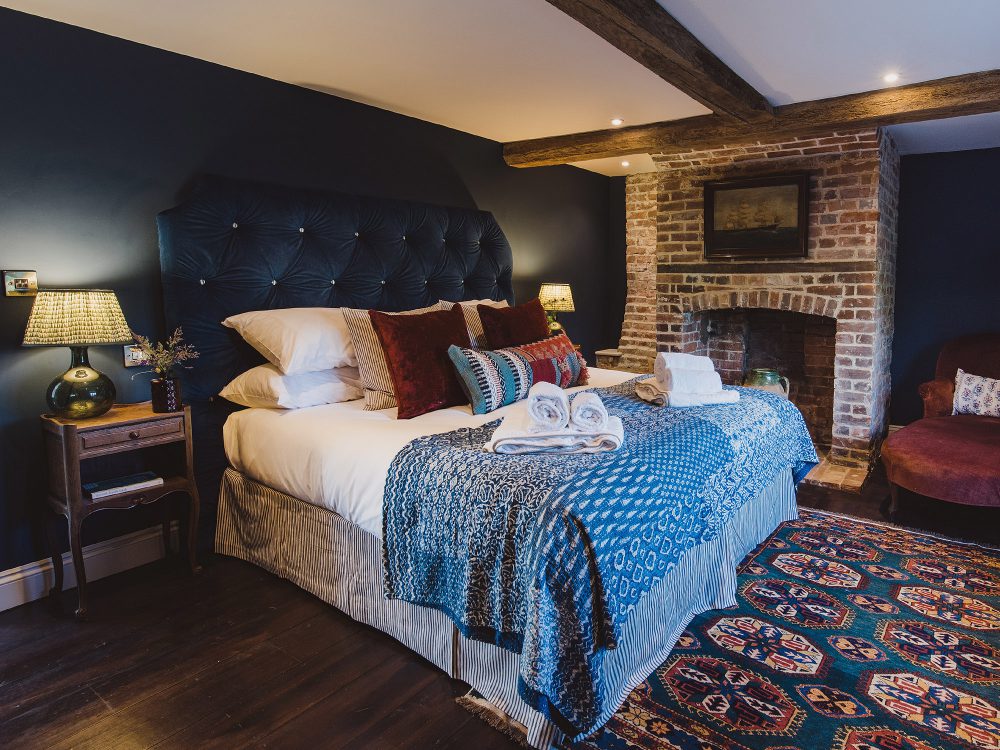 The blue bedroom at Kingshill farmhouse on the Elmley Nature Reserve. Interior design & styling by Rowan Plowden Design.